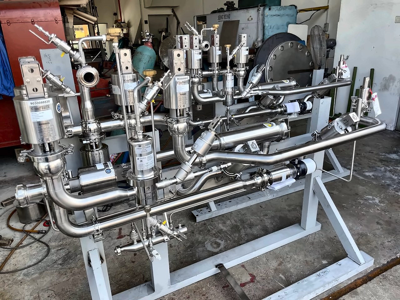 Sanitary valve manifold skid with stainless piping